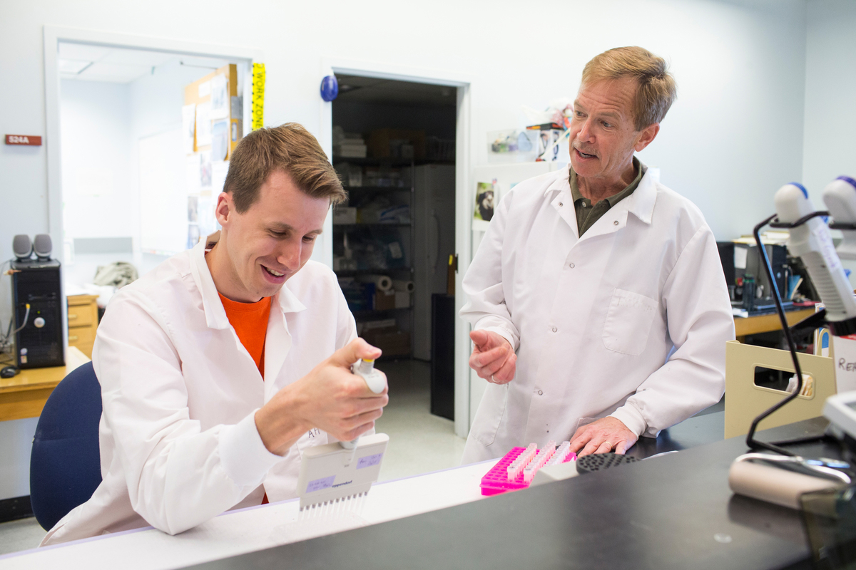 Jon-Ryan Cavanaugh (left) conducts an enzyme immunoassay with Dr. Jeff French (right), a common occurrence in UNO's Endocrine BioServices Laboratory.